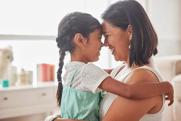 mother and daughter smiling together